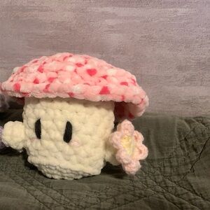 Crochet Mushroom Plush holding a flower
